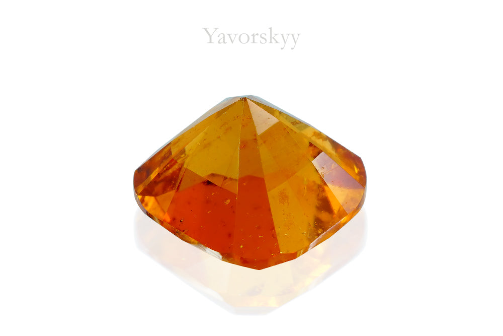 A back view photo of 0.97 ct clinohumite