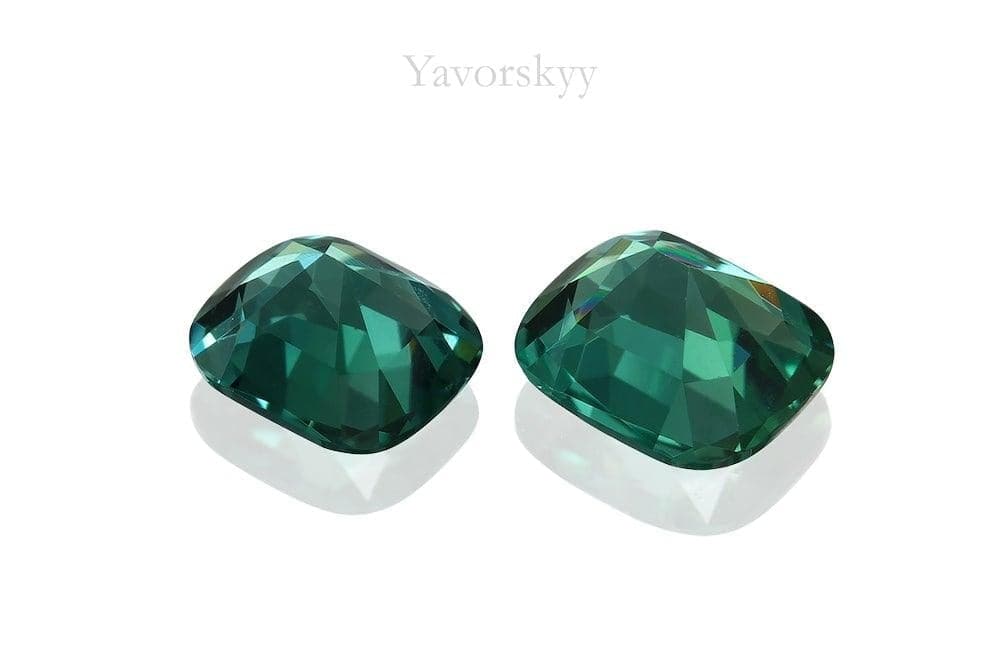 Photo of bottom view of green tourmaline 0.70 carat matched pair