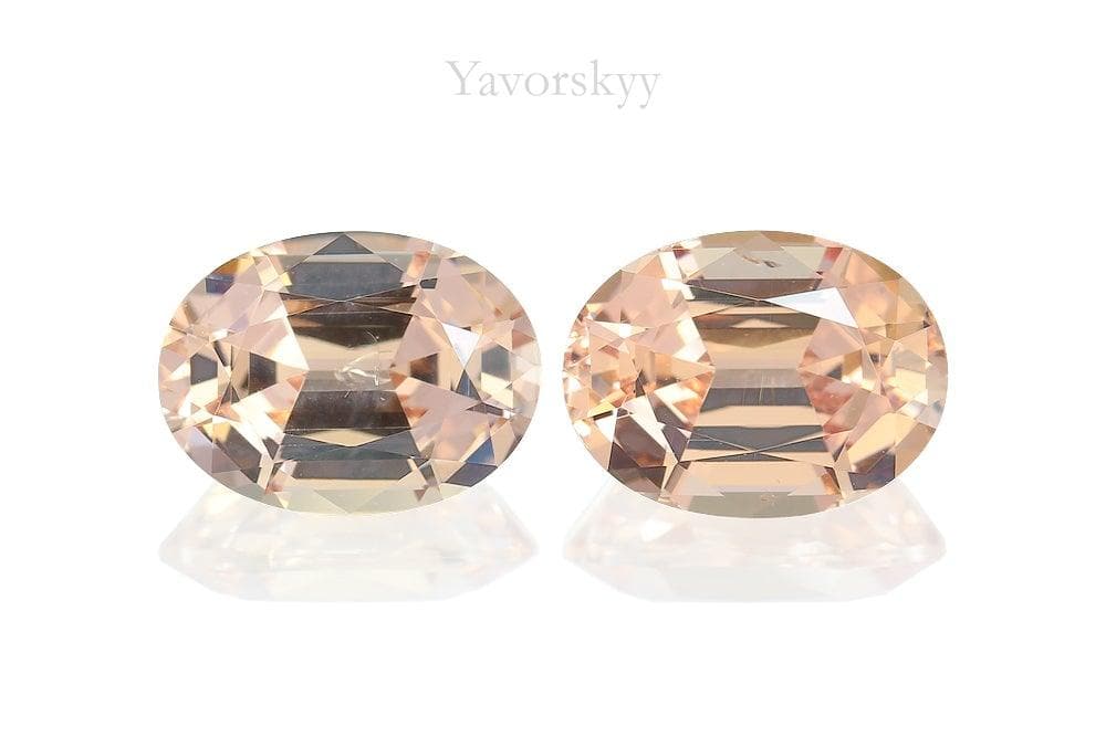 A pair of orange malaia garnet oval 3.24 carats front view picture