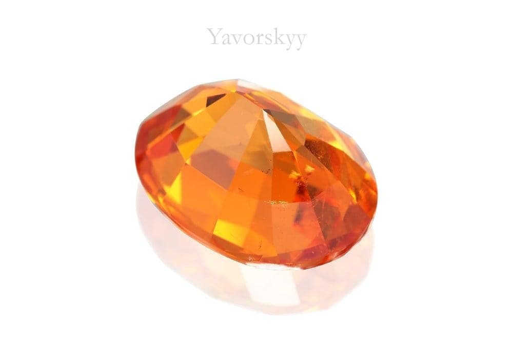 Photo of orange shape spessartite 6.12 cts bottom view