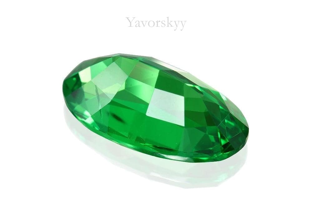 A back side image of 5.68 ct tsavorite oval