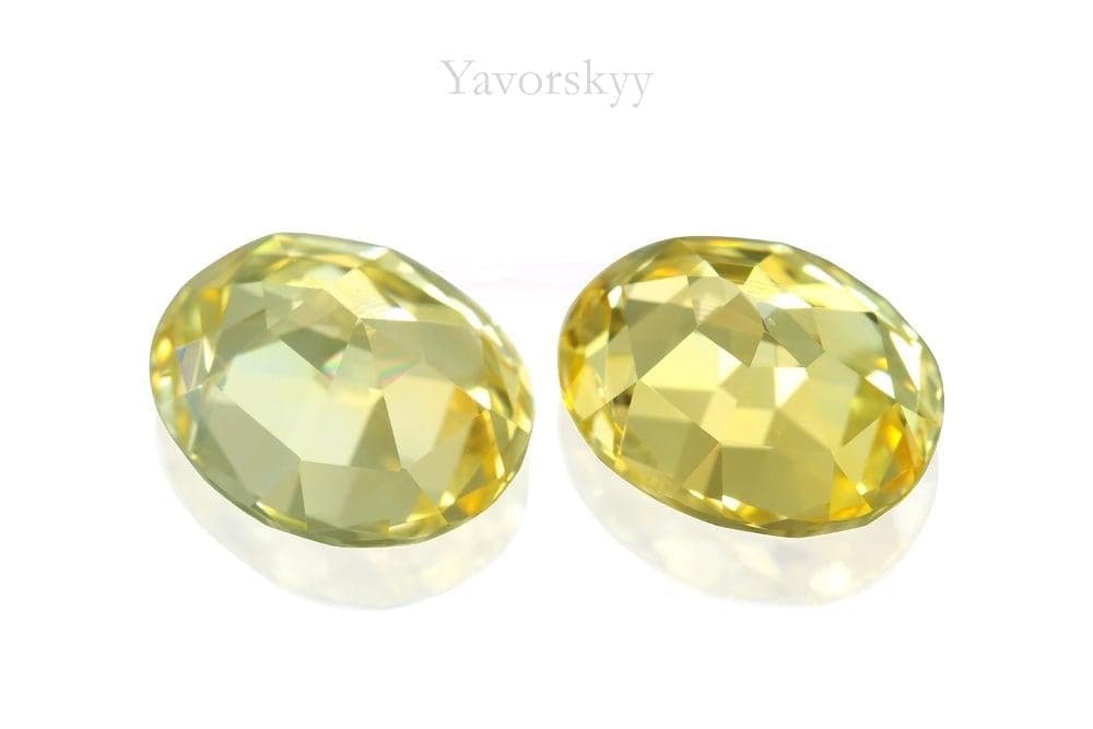 Photo of back side of yellow sapphire 6.31 cts pair