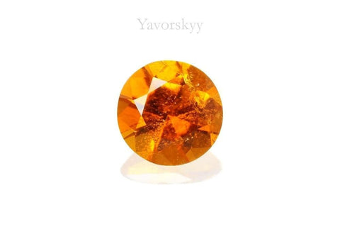 Round cut clinohumite 0.62 carat front view photo