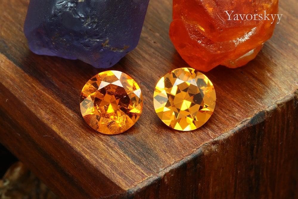 Front view picture of round mandarin garnet 1.22 cts pair