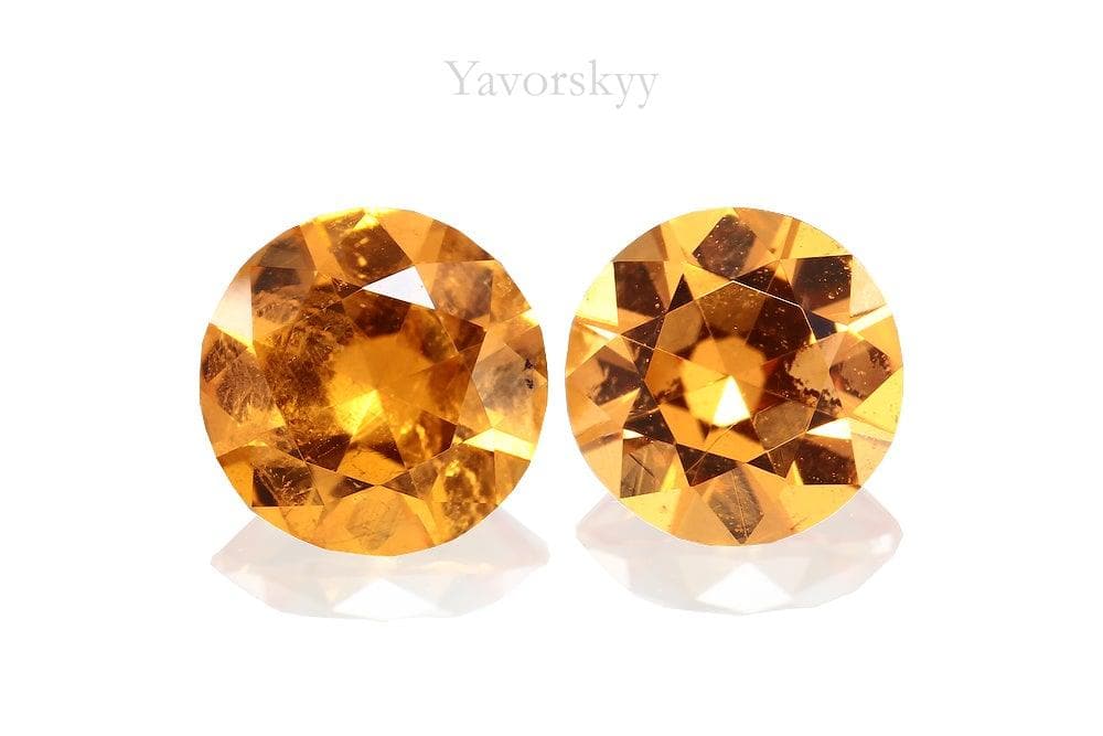 Top view photo of round mandarin garnet 1.24 carats pair