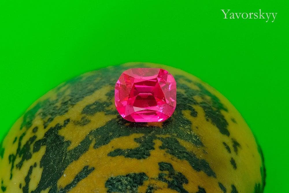 A front view photo of 0.85 ct red spinel